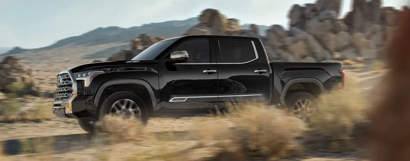 Black 2026 Toyota Tundra Limited driving down a trail