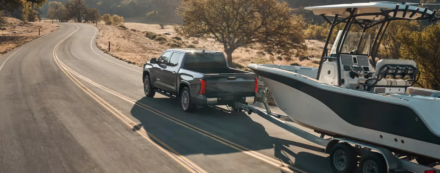 Grey 2026 Toyota Tundra  towing a boat