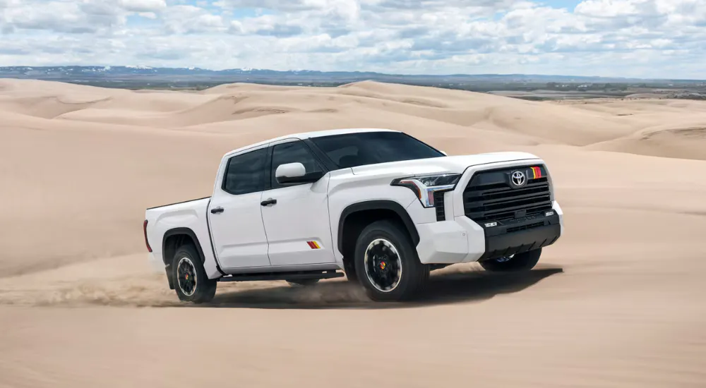 White 2026 Toyota Tundra Rally driving across sand