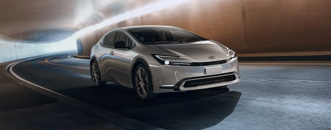 A silver 2027 Toyota Prius driving in a tunnel