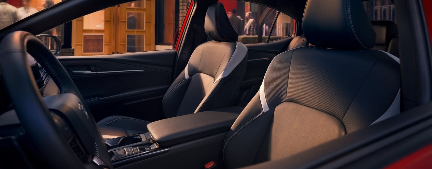 Front seats in a red 2026 Toyota Camry Nightshade