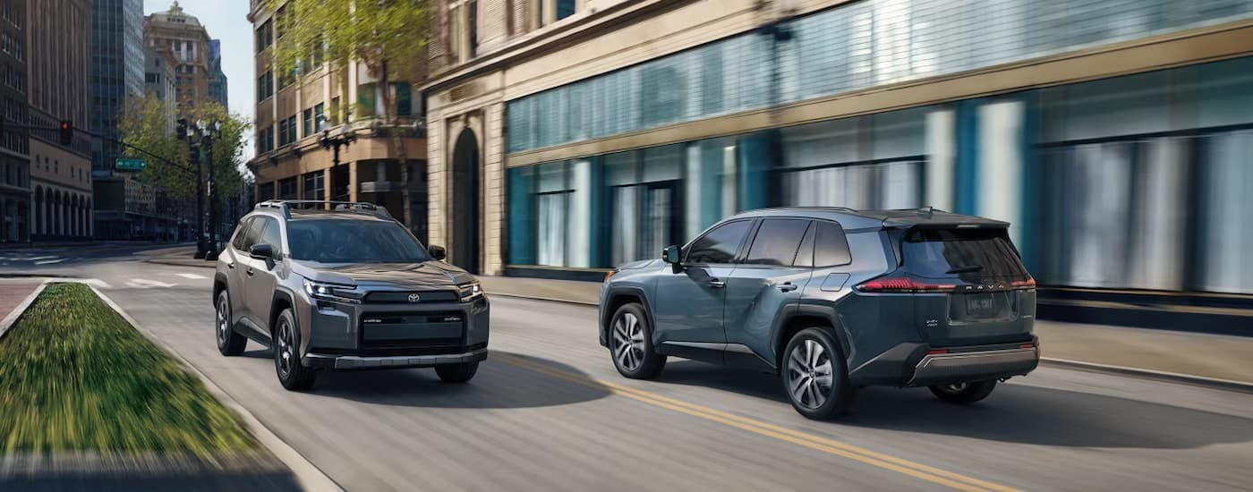 Two 2026 Toyota RAV4s driving on a city street