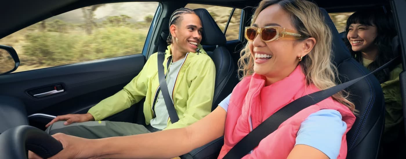 Group of people driving in a 2026 Toyota Corolla Cross