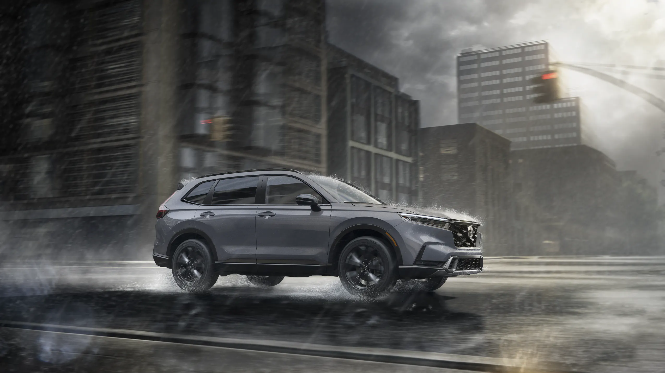 Honda CR-V Hybrid driving through rain in downtown Juneau