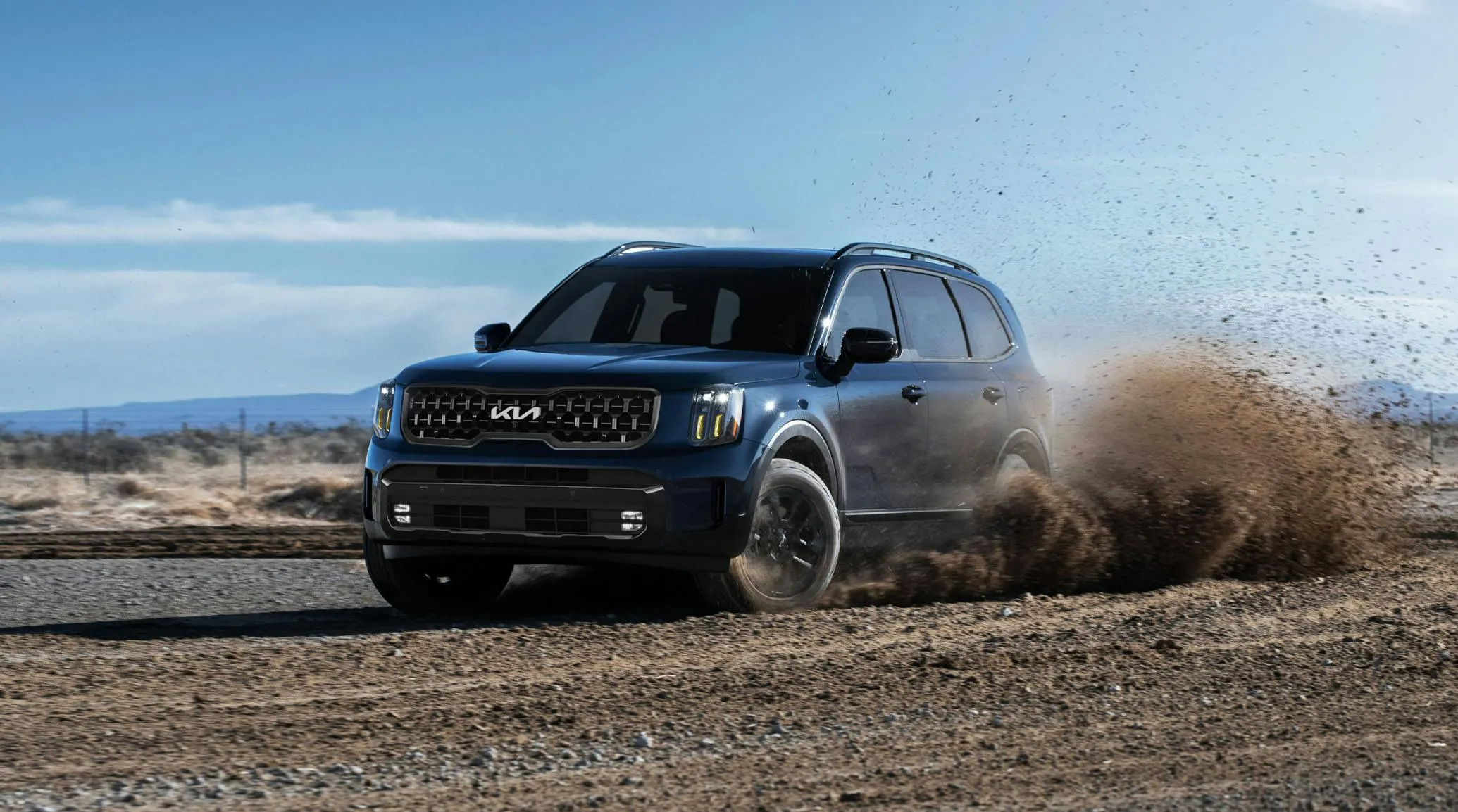 Kia Telluride driving in the dirt