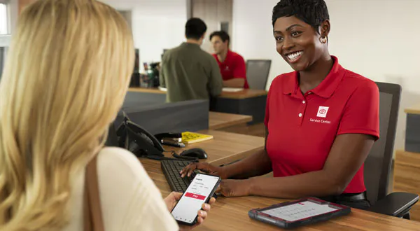 Toyota Service Advisor Interacting with Customer