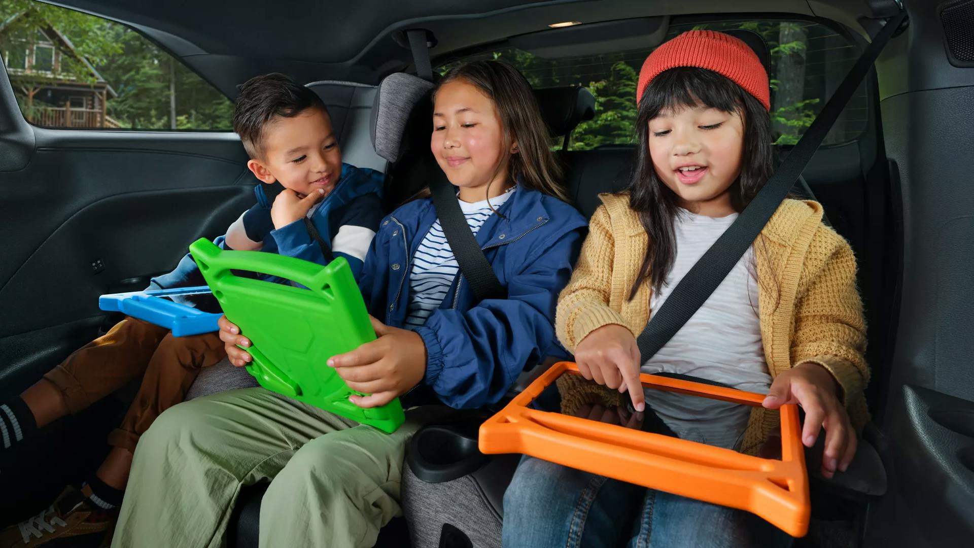 kids having fun in the back seat of a Sienna