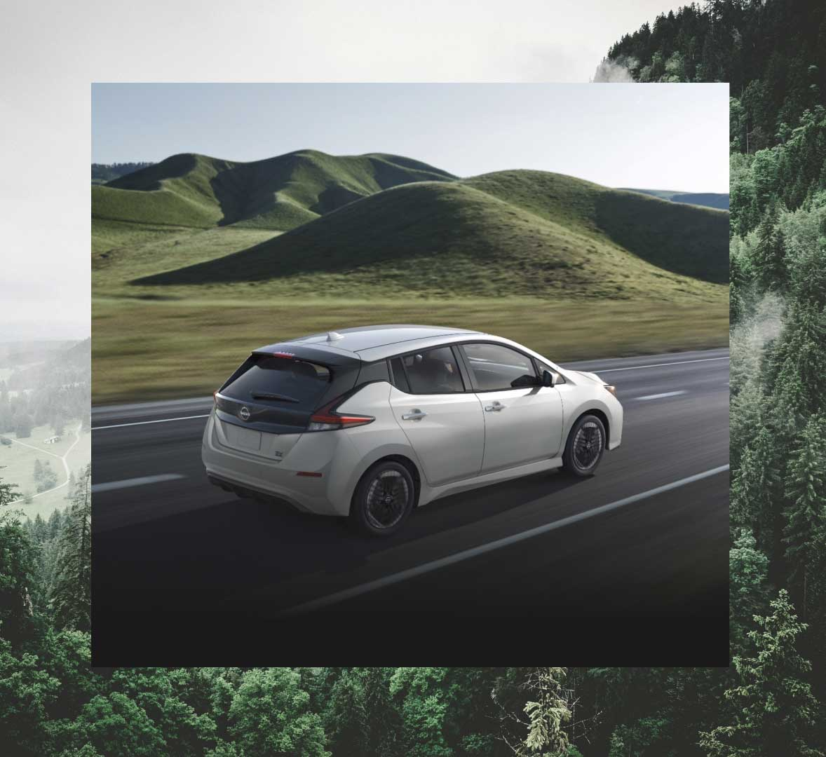 Nissan Leaf driving in front of hills