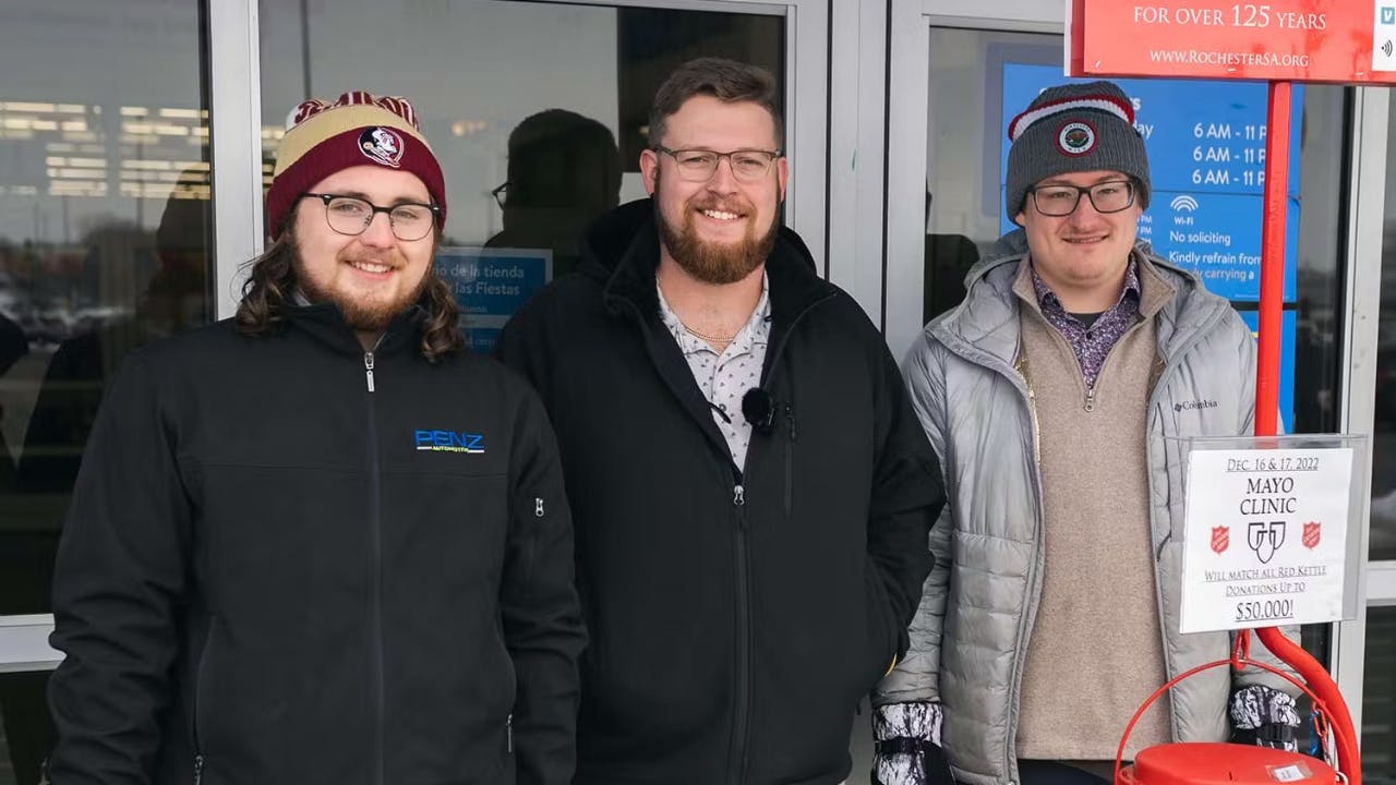 three men smiling