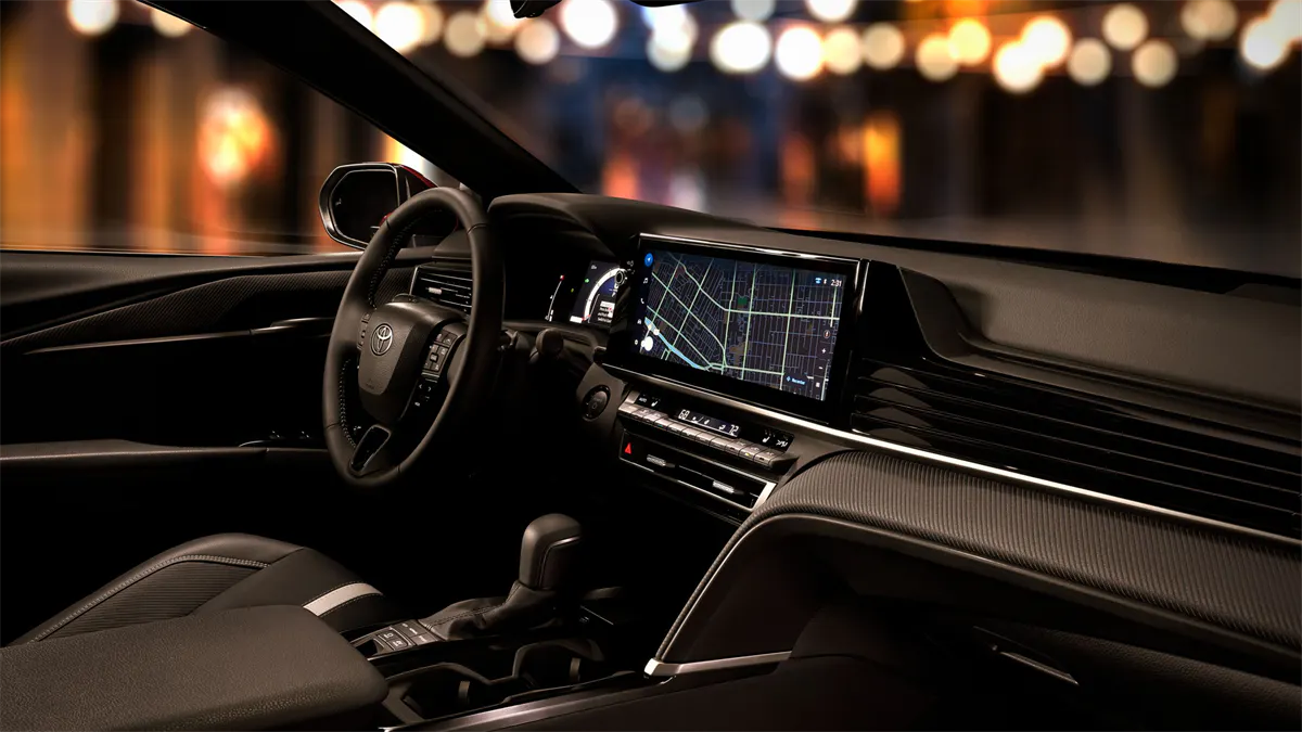 Interior view of the 2026 Toyota Camry highlighting the dashboard and touchscreen amenities