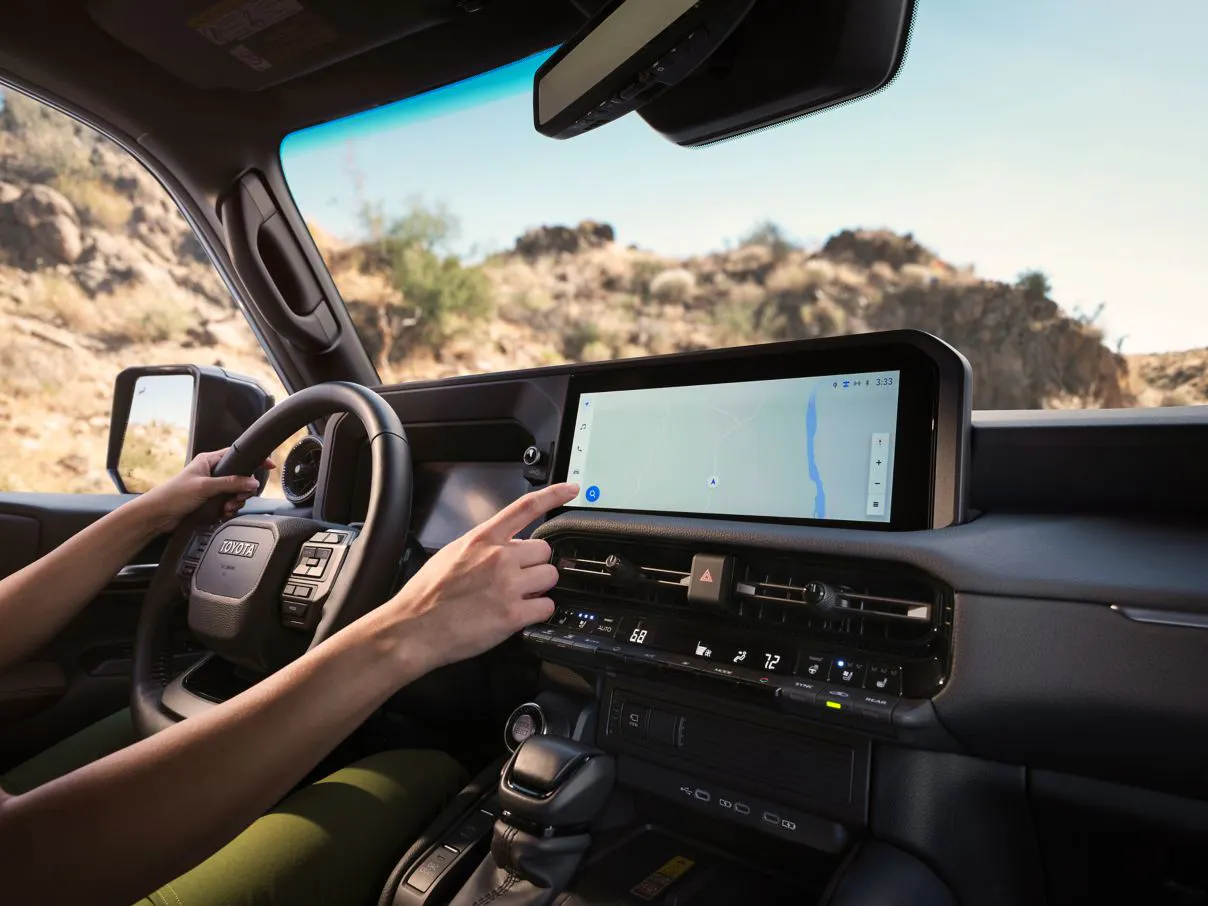 Modern interior dashboard of the 2027 Toyota Land Cruiser featuring touchscreen display and digital instrument cluster