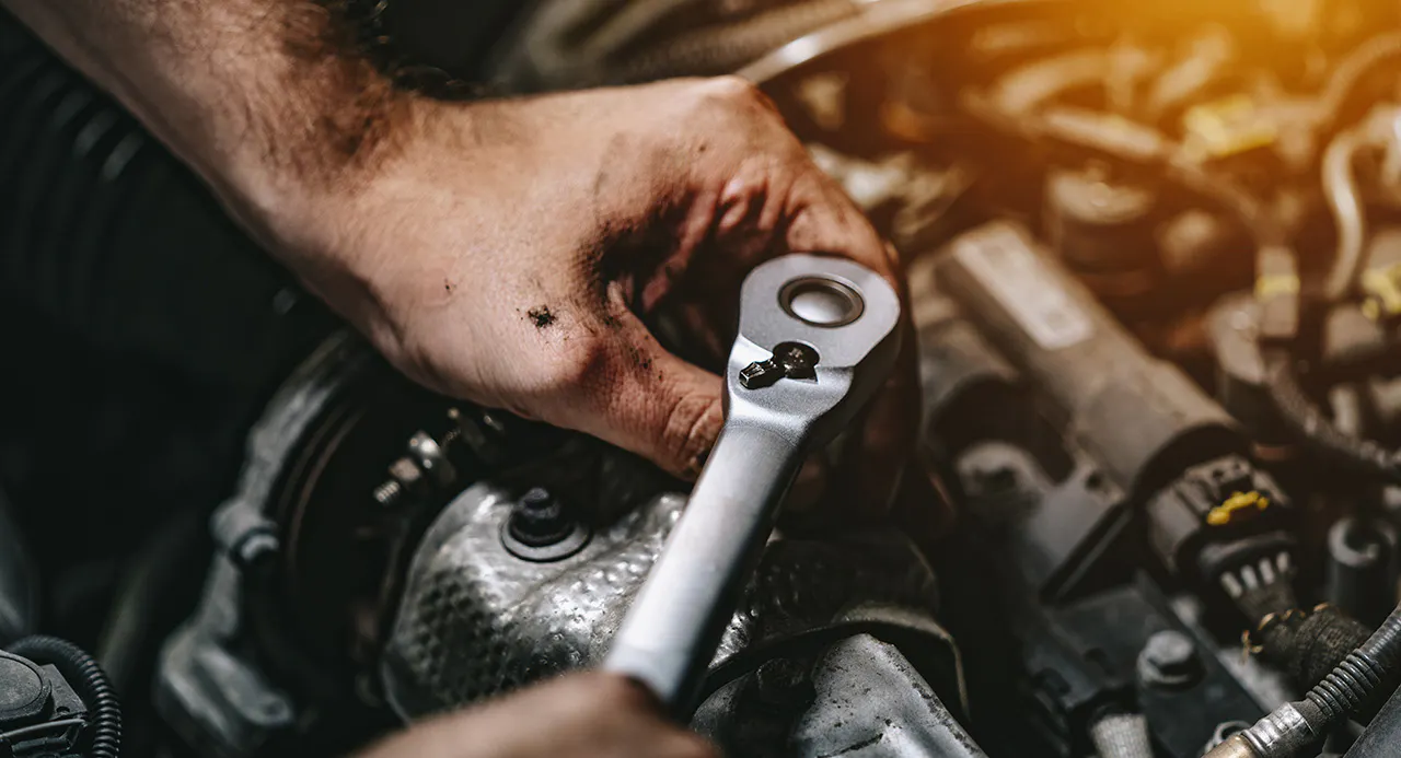 Toyota service technician working under the hood