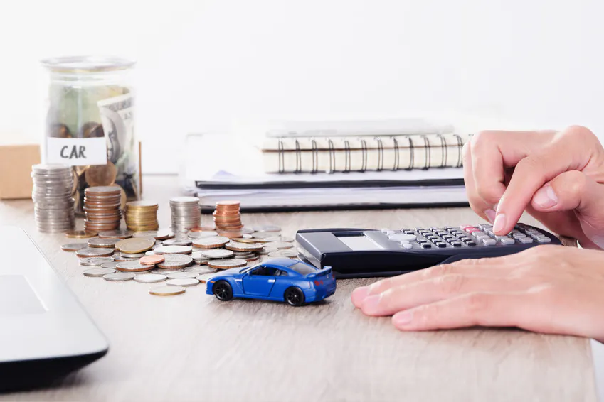 Person calculating Toyota financing