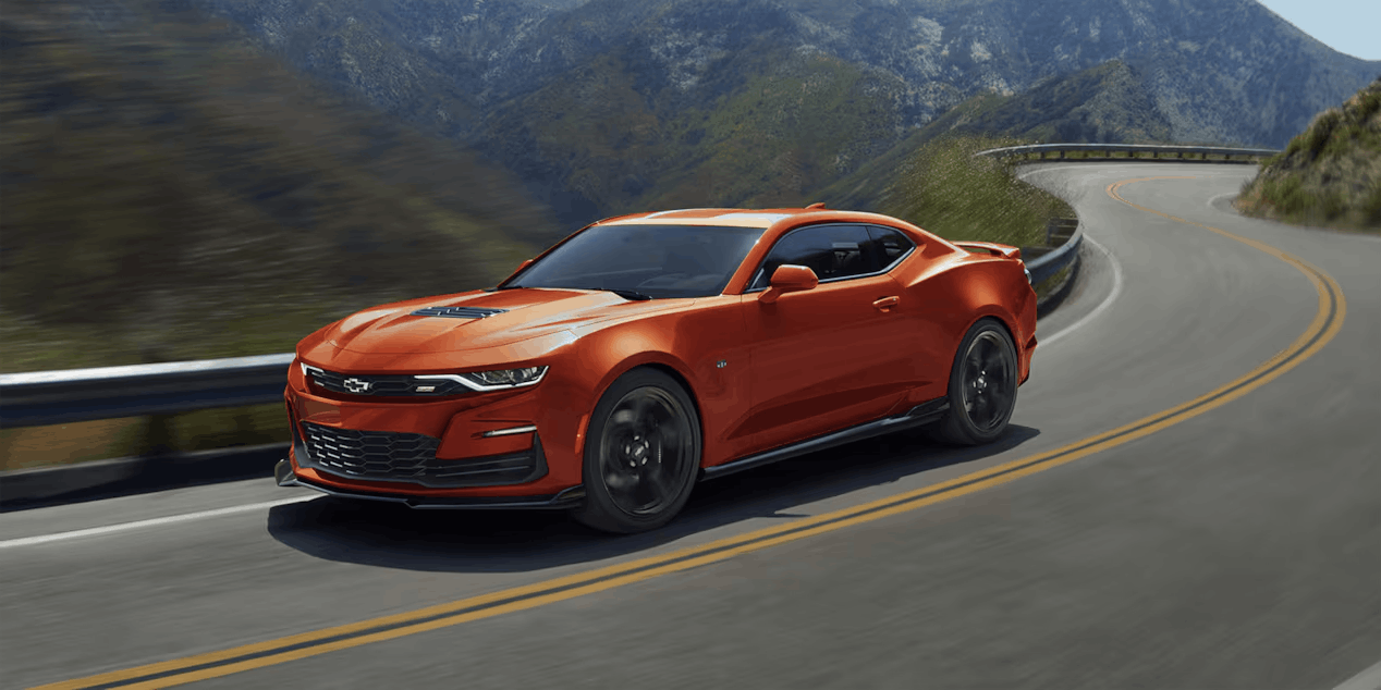 orange camaro on road