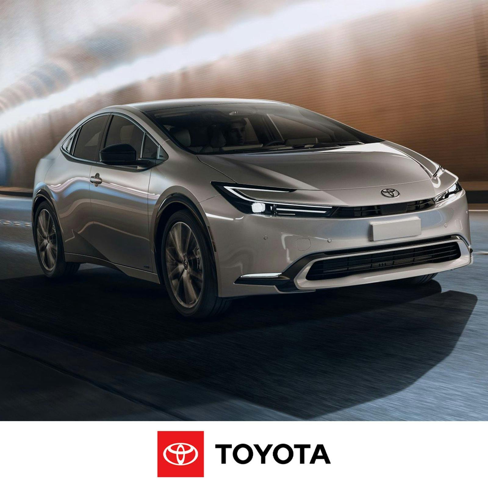 Prius exterior2 A white Toyota Prius in motion inside a tunnel with lighting and blurred brick wall