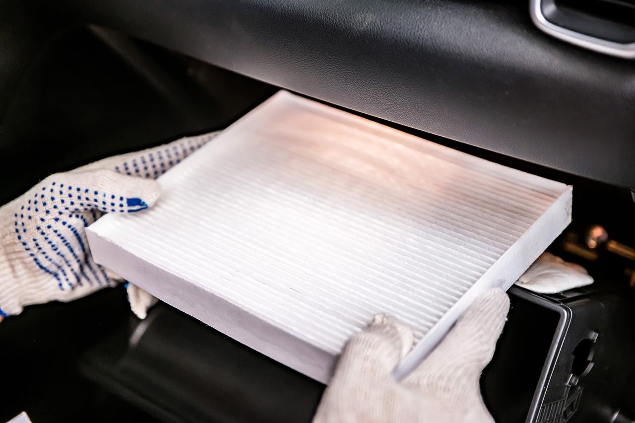 Cabin air filter being replaced