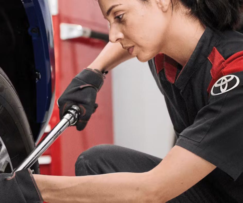 a Steven Toyota technician changing a tire