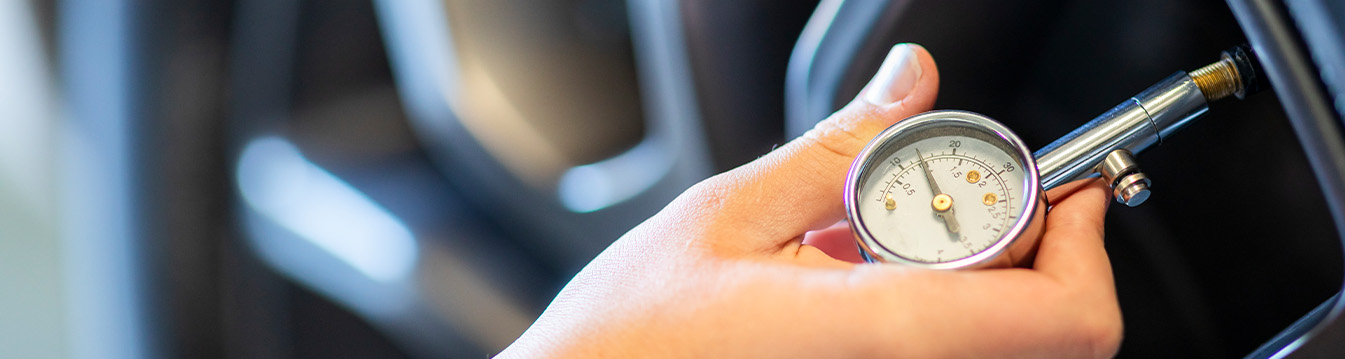 Tire Pressure Information at Team Toyota of Glen Mills in Glen Mills, PA | Close up of tire pressure tool being used to read the tire pressure