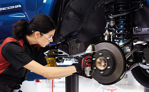 3 Main Benefits of Using OEM parts for your vehicle at Team Toyota of Glen Mills in Glen Mills, PA | Female mechanic installing new brakes onto vehicle