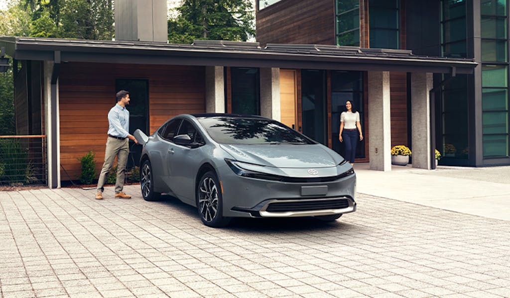 Most Fuel Efficient Toyota Models at Team Toyota of Glen Mills | Man charging his parked Toyota Prius at home