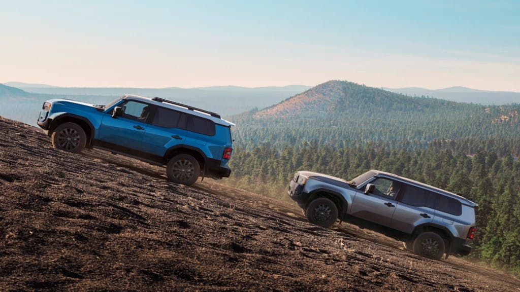 2 land cruisers 24 2 land cruisers 24 driving uphill