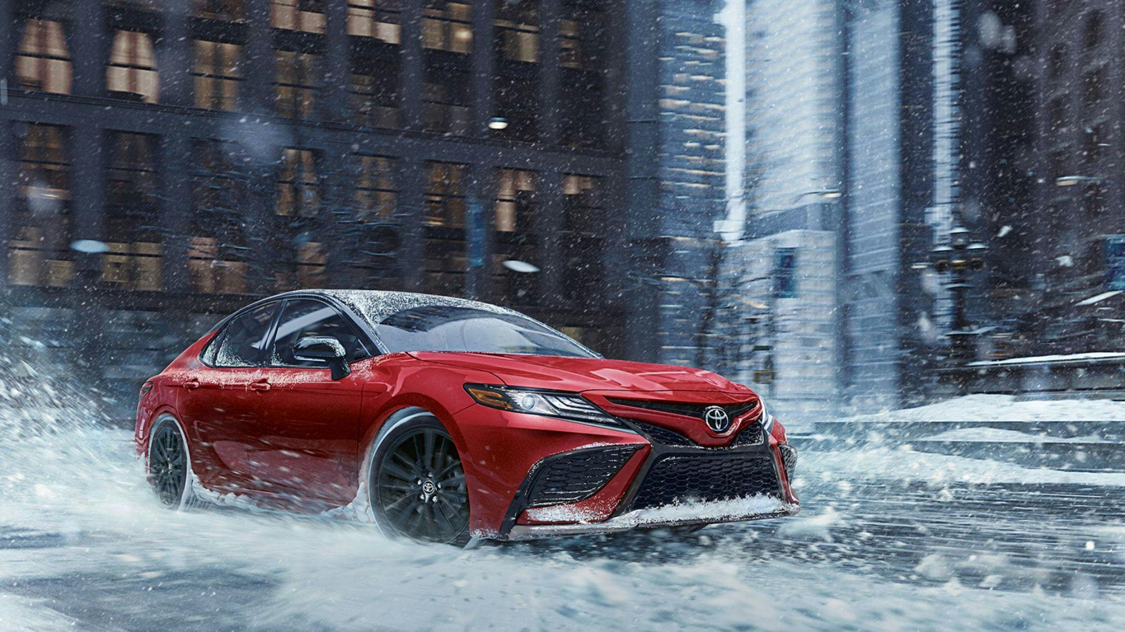 red camry in the water and snow red camry in the water and snow driving