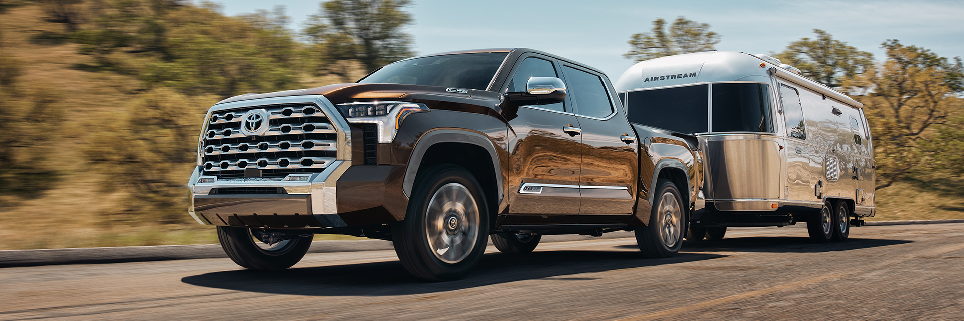 2026 Toyota Tundra parked against a scenic backdrop, showcasing its rugged design and imposing presence.