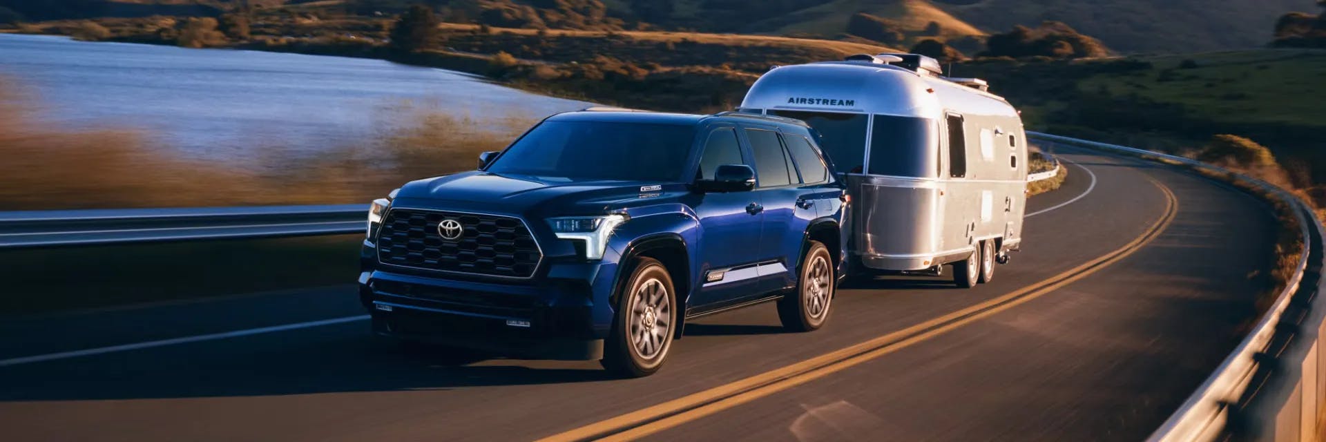 Blueprint color 2025 Toyota Sequoia towing an Airstream RV