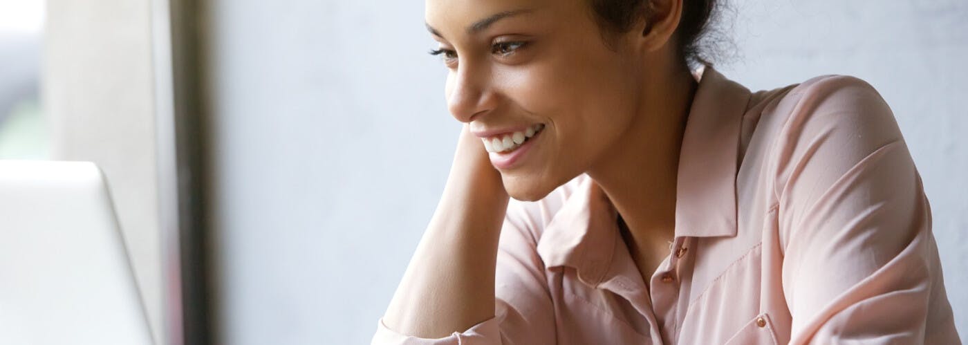 pink shirt lady smiling