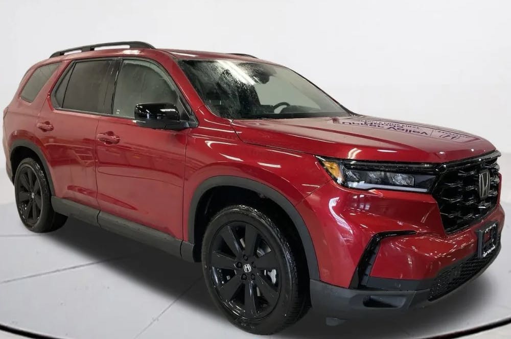 Honda SUV with black rims