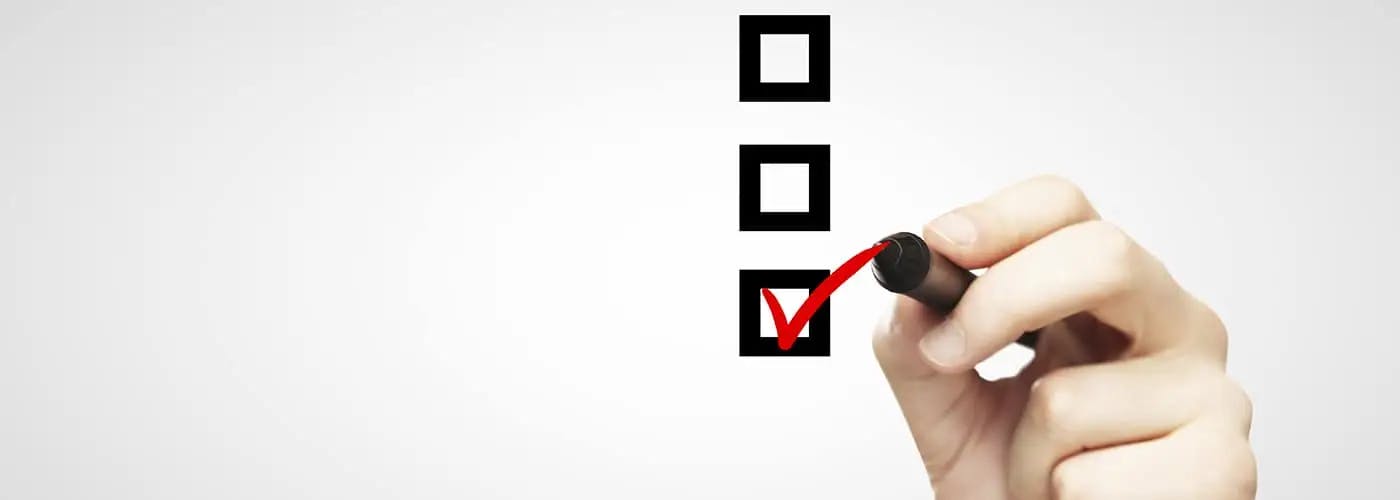 hand checking off checklist