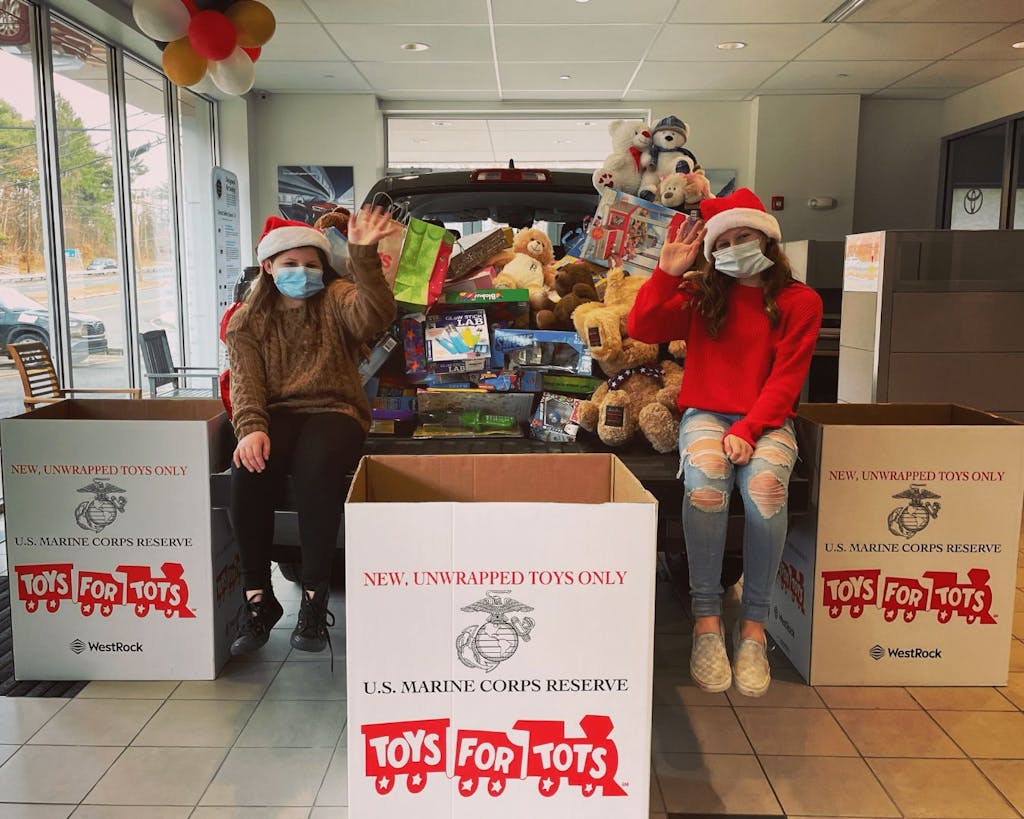 girls waving in santa hats girls waving in santa hats