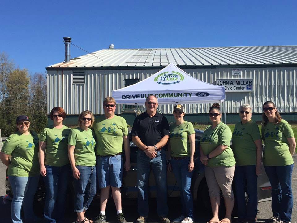 staff in green shirts